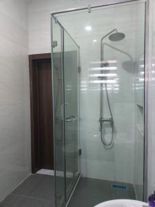 a glass shower in a bathroom with a sink at 2 bedroom Apartment Lekki Ovation Terrace in Lekki