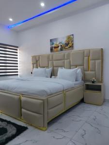 a large bedroom with a large bed in a room at 2 bedroom Apartment Lekki Ovation Terrace in Lekki