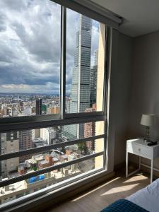 Ένα ή περισσότερα κρεβάτια σε δωμάτιο στο Bogota Luxury Loft Privado 2926