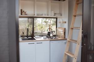 a kitchen with a sink and a window at Tiny Ikigai in Wallan