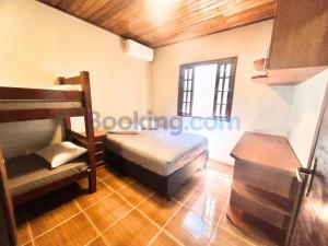 Ένα ή περισσότερα κρεβάτια σε δωμάτιο στο Recanto da Palmeira - Piscina aquecida, quartos com ar condicionado +37 φωτογραφίες