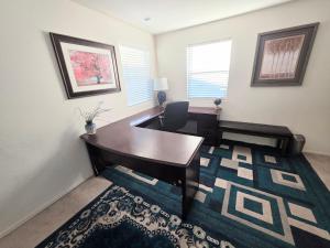 a office with a desk and a chair in a room at 2-Bedroom Entire Guest Suite in North Las Vegas Mountain Views in Las Vegas