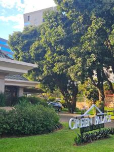 a sign for a green park hotel room at Green Palace Hotel Boutique in Asuncion