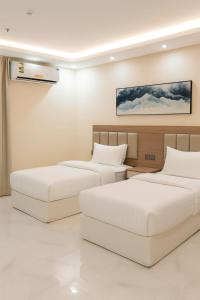 Ένα ή περισσότερα κρεβάτια σε δωμάτιο στο فندق الضيافة +16 φωτογραφίες