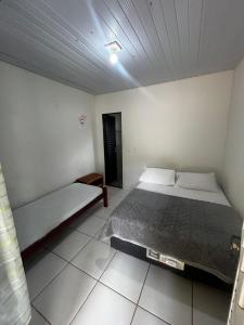 Ένα ή περισσότερα κρεβάτια σε δωμάτιο στο Pousada São Martins +4 φωτογραφίες