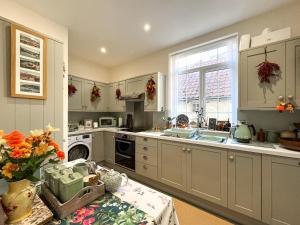 Kuchyň nebo kuchyňský kout v ubytování Hildas Hideaway