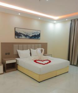 Ένα ή περισσότερα κρεβάτια σε δωμάτιο στο فندق الضيافة