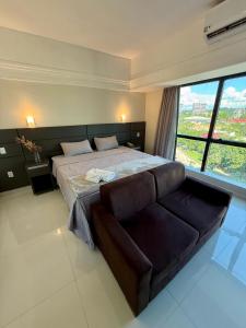 Ένα ή περισσότερα κρεβάτια σε δωμάτιο στο Loft vista ponta negra