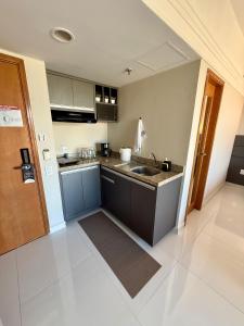 Η κουζίνα ή μικρή κουζίνα στο Loft vista ponta negra