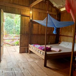 Postel nebo postele na pokoji v ubytování Tribal Village Homestay & Trekking