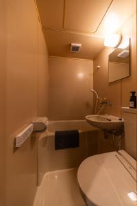 a small bathroom with a toilet and a sink at おやど紀伊国屋えびす町 in Nagasaki +60 photos
