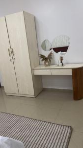 Ένα ή περισσότερα κρεβάτια σε δωμάτιο στο Serenity by Feliho House +1 φωτογραφίες