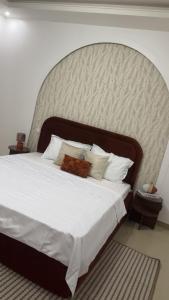 Ένα ή περισσότερα κρεβάτια σε δωμάτιο στο Serenity by Feliho House