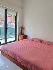 Postel nebo postele na pokoji v ubytování OneA Homtays