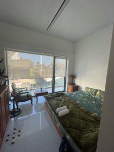 Postel nebo postele na pokoji v ubytování OneA Homtays