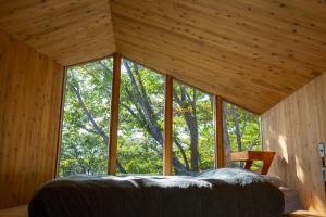 Postel nebo postele na pokoji v ubytování Earthboat Nasu