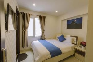 Ένα ή περισσότερα κρεβάτια σε δωμάτιο στο Thanh Downtown Hotel - Bước Chân Là Đến Chợ Đêm +15 φωτογραφίες