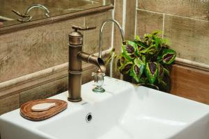 a sink with a faucet on top of it at Miwu Homestay in Liping +63 photos