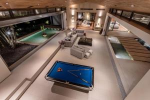 an overhead view of a living room with a pool table at Villa Cielo in Ban Han Pa To