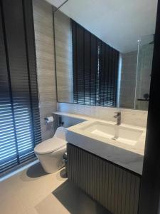 a bathroom with a sink and a toilet at Antara Genting by Enigma 2BR, Mid Floor in Genting Highlands