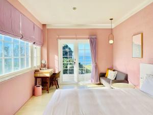 Un pat sau paturi într-o cameră la Canaan B&B Kenting