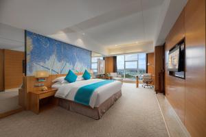 Μια τηλεόραση ή/και κέντρο ψυχαγωγίας στο Zhangjiajie Grand Huatian Hotel at Tianmen Cable Car By the River +22 φωτογραφίες