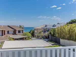 a view of the ocean from the balcony of a house at The Sand Box in Kingscliff