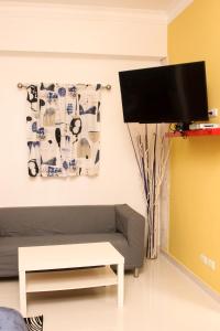 TV a/nebo společenská místnost v ubytování Apartahotel Guaraguao