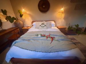 a bedroom with a bed with kites on it at Villa Soluna Lovina in Lovina