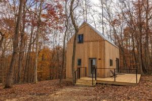 a wooden house in the middle of the woods at The Klover in Logan +38 photos