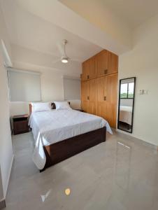 Ένα ή περισσότερα κρεβάτια σε δωμάτιο στο Prado Garden Hotel