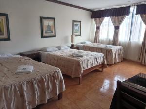 Ένα ή περισσότερα κρεβάτια σε δωμάτιο στο Hospedaje El Escudero