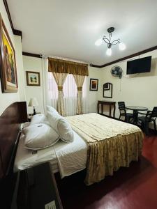 Ένα ή περισσότερα κρεβάτια σε δωμάτιο στο Hospedaje El Escudero