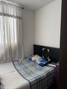 Ένα ή περισσότερα κρεβάτια σε δωμάτιο στο Hermoso apartamento amoblado en Dosquebradas +32 φωτογραφίες