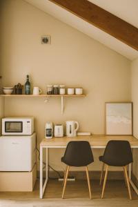 O bucătărie sau chicinetă la Queen's Tiny Nook by Peakhost