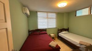 Ένα ή περισσότερα κρεβάτια σε δωμάτιο στο Beachfront apartment in Salinas Malecom