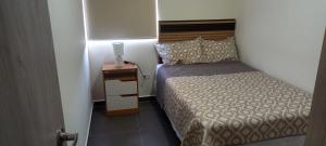 Giường trong phòng chung tại Apto 52 Lomas