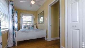 a bedroom with a window and a bed in a room at 1BR 1BA NorthStar Bungalow. Just Steps to the beach and the bay. in St Pete Beach
