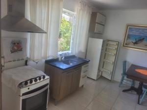 Η κουζίνα ή μικρή κουζίνα στο Beach house