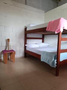 a couple of bunk beds in a room at Lunaria Pacífico in El Valle +13 photos