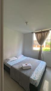 Ένα ή περισσότερα κρεβάτια σε δωμάτιο στο Apartamento familiar