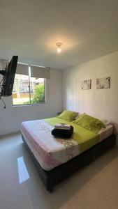 Ένα ή περισσότερα κρεβάτια σε δωμάτιο στο Apartamento familiar