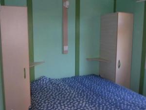 a bedroom with a bed and two wardrobes at Chalet 32m² avec Terrasse - 2 Chambres - API-1-52-939 in La Chapelle