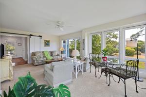 a living room with a couch and a table at RD2224: 2224 Rolling Dune in Seabrook Island