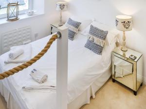 En eller flere senge i et værelse på Magdala Garden