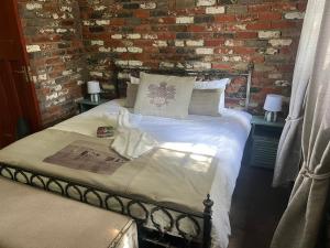 Ένα ή περισσότερα κρεβάτια σε δωμάτιο στο Vallombrosa Cottage