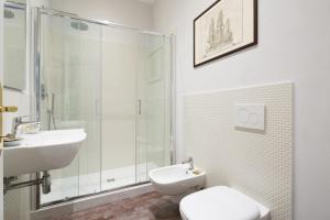 a bathroom with a sink and a toilet and a shower at B&B Residenza San Gallo 79 in Florence