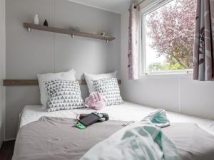 Postel nebo postele na pokoji v ubytování Mobile-home 31m² avec Terrasse à Piriac-sur-Mer - API-1-52-964