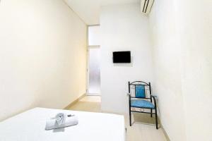 Μια τηλεόραση ή/και κέντρο ψυχαγωγίας στο VS Guest House Tangerang RedPartner