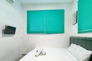 Μια τηλεόραση ή/και κέντρο ψυχαγωγίας στο VS Guest House Tangerang RedPartner